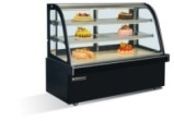 Una vetrina di torte di grado Forni da forno commerciali Display di torte isolate con base in marmo / acciaio inossidabile